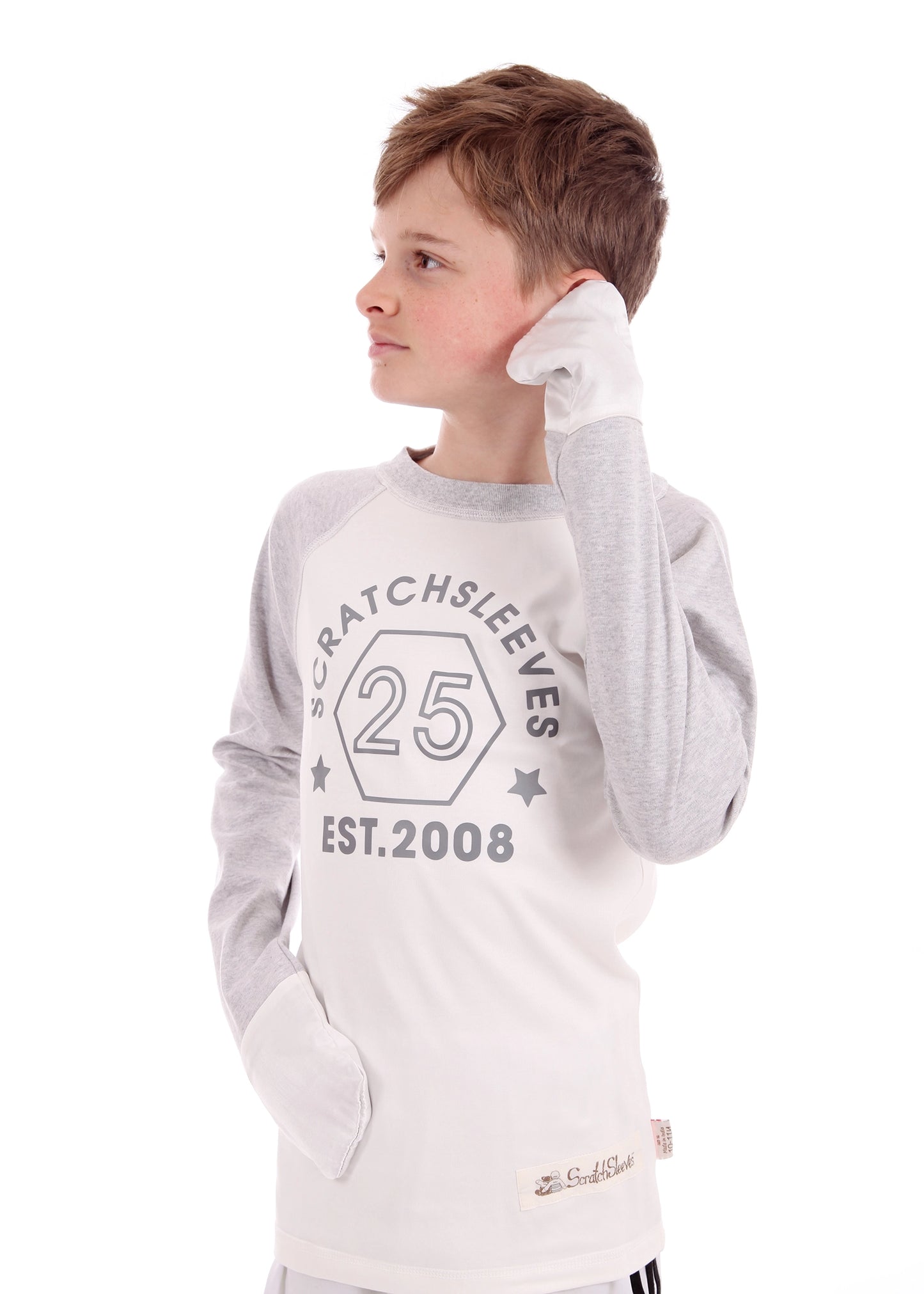 Baseball-style Scratch Sleeves tops for children and teens, designed to help manage eczema with soft, breathable fabric and fold-over mitts to prevent scratching.